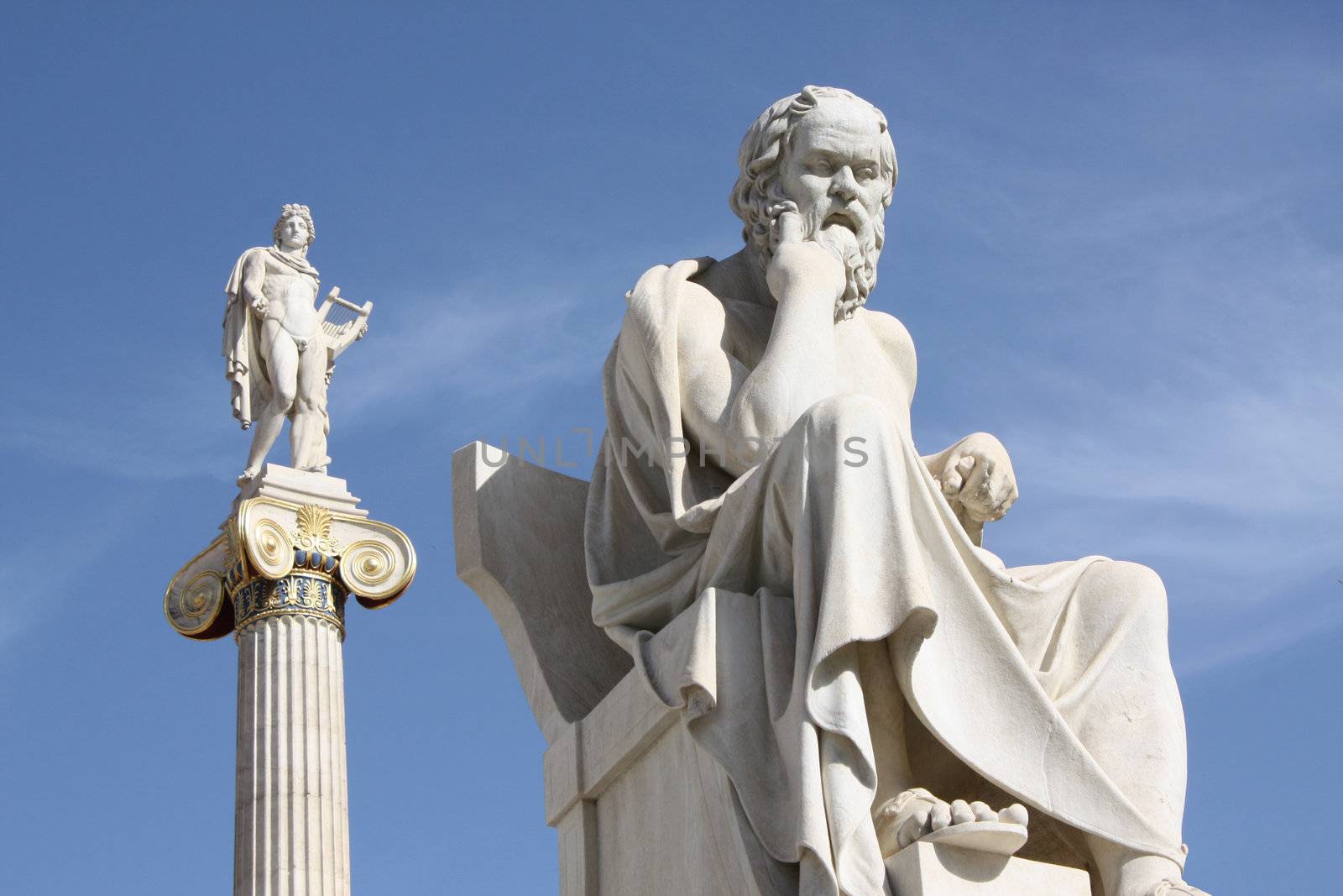 Neoclassical statues of Socrates (Greek ancient philosopher) and Apollo (god of  the sun, medicine and the arts) in front of the Academy of Athens, Greece.