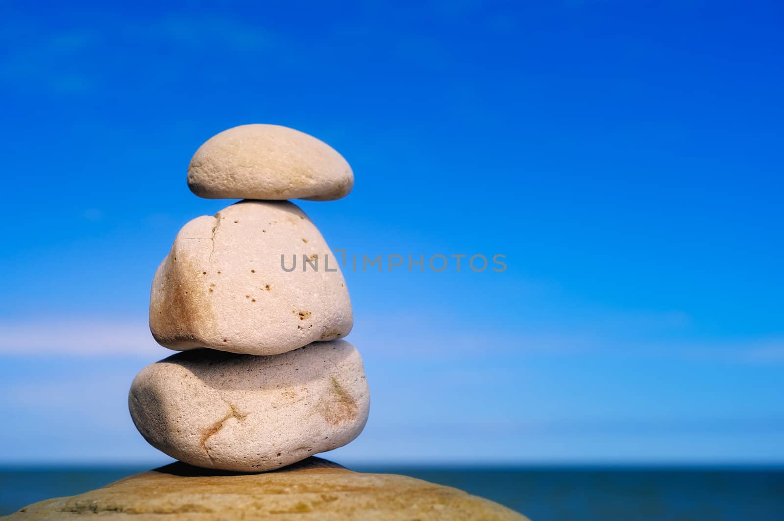 Three the yellow stones on the coast