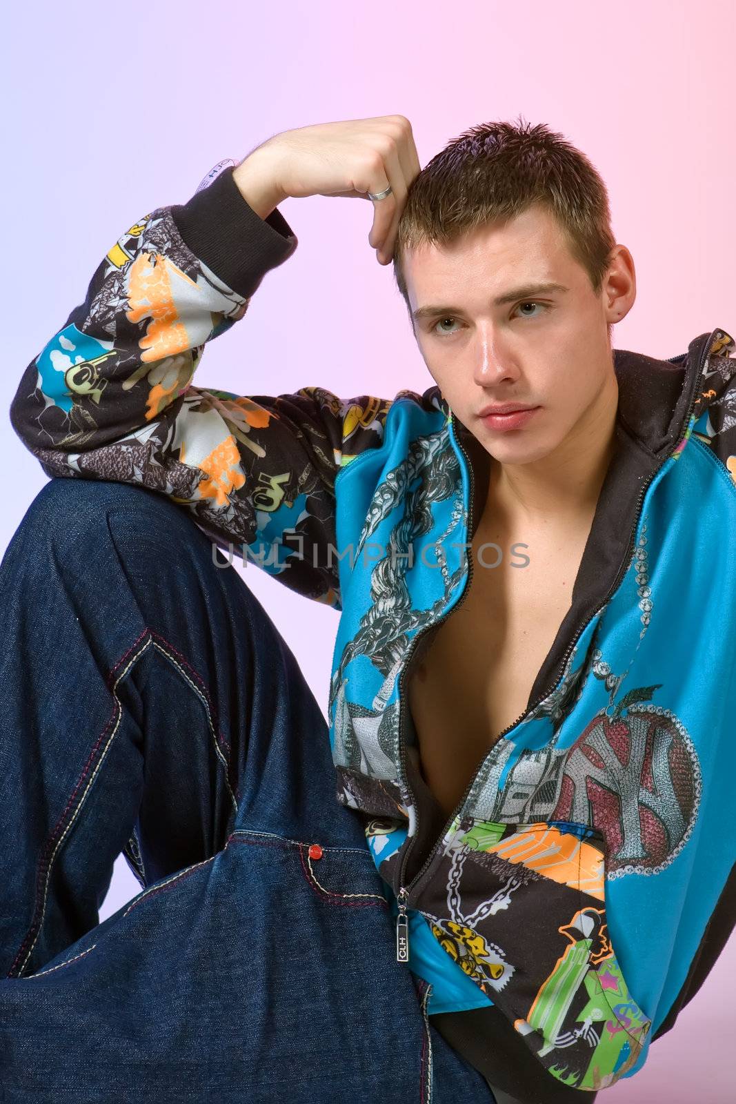 The young man posing in studio by MIL