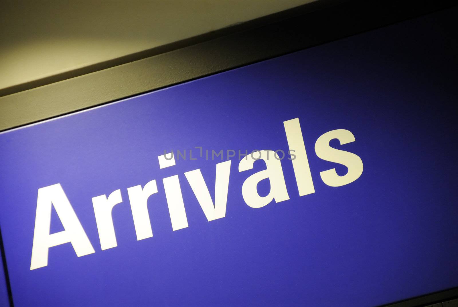 Arrivals sign at the airport terminal