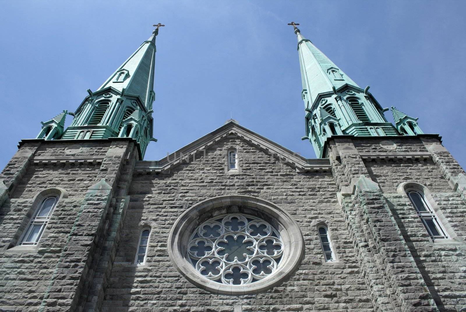 Old Catholic church reaching the blue sky.