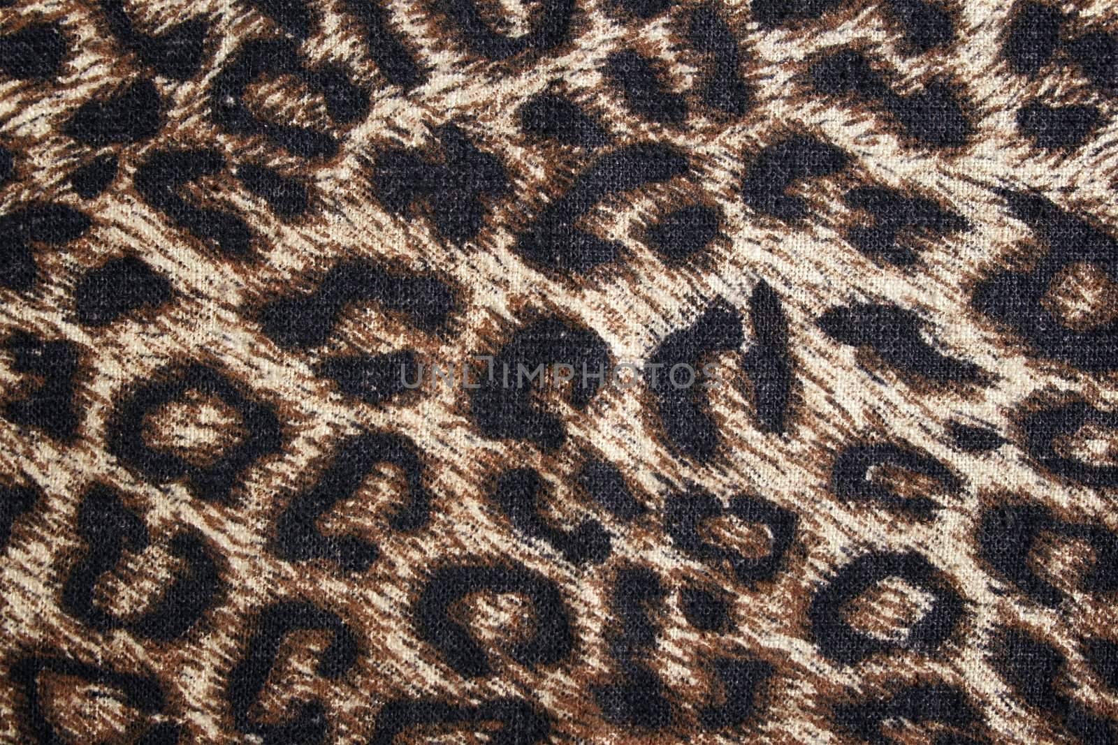 Leopard spotted fabric background by anikasalsera