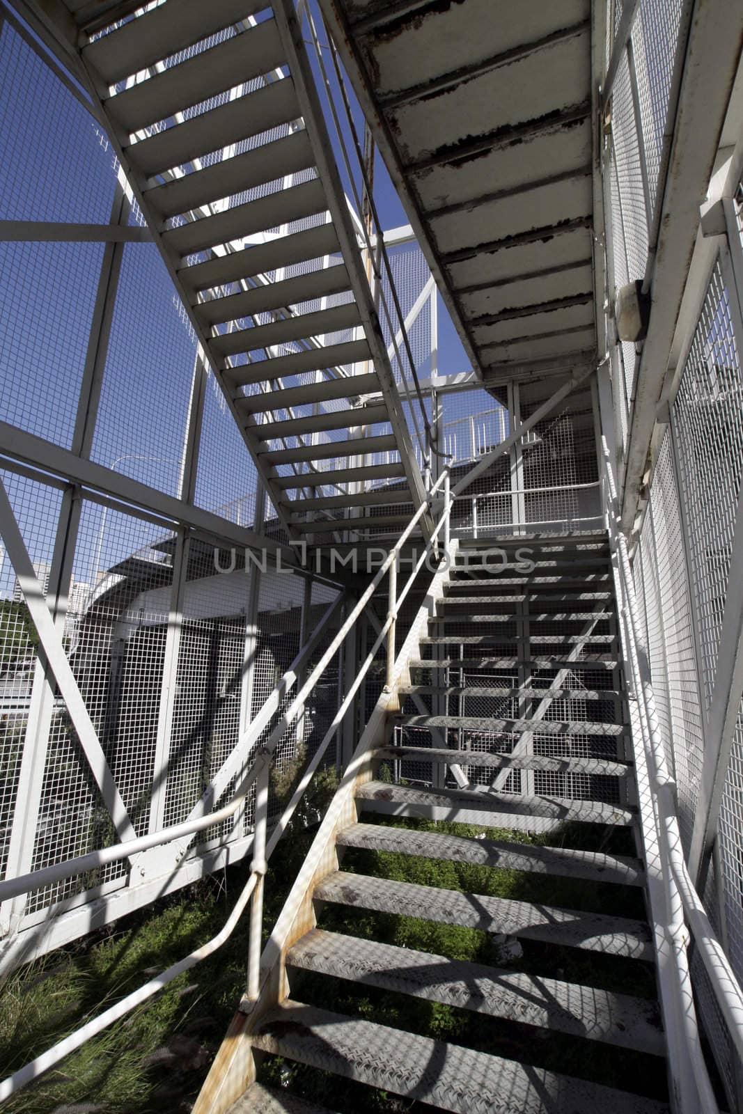 Urban Metal Stairs With Chain-Wire Fence, Clear Blue Sky, Summer Day