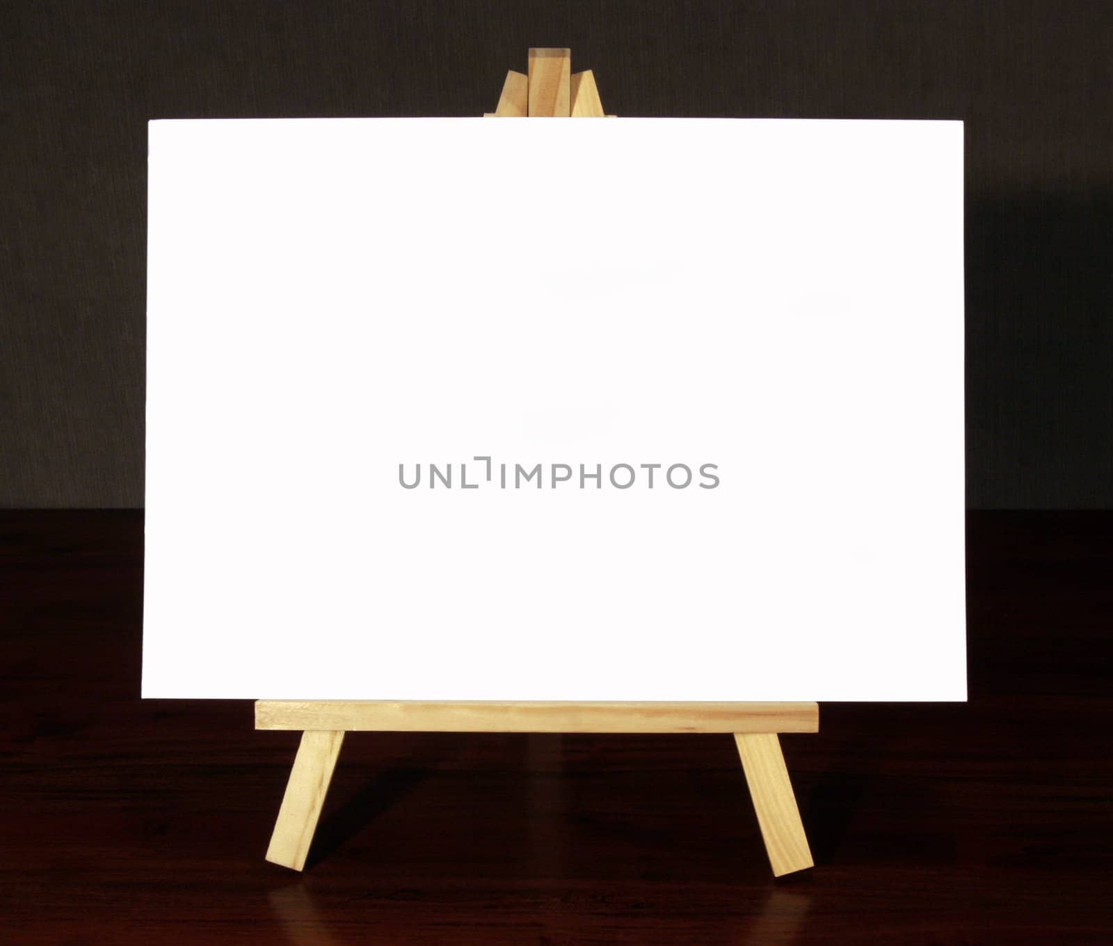 Wood Easel With White Canvas On A Black Background, Isolated