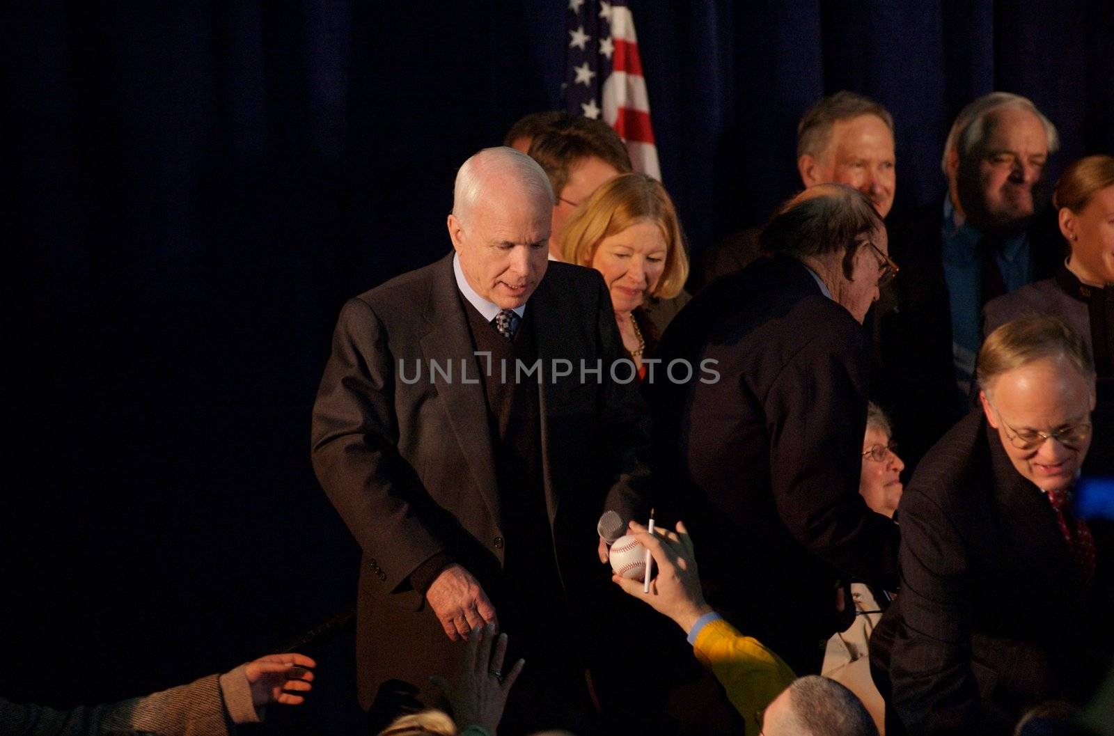 Senator John McCain, on his presidential campaign, gives a speech in South Burlington, VT.  This one is particular because a member of the crowd is handing McCain a baseball to sign.
