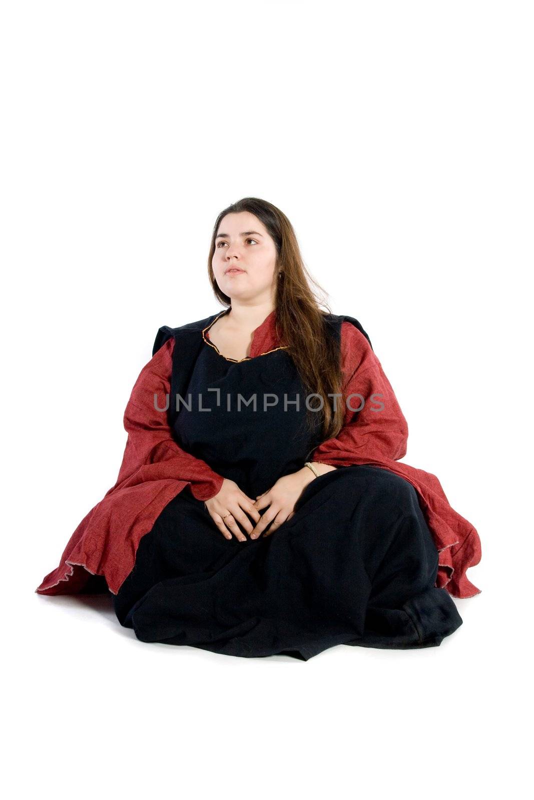 An isolated photo of a woman in a fancy medieval dress