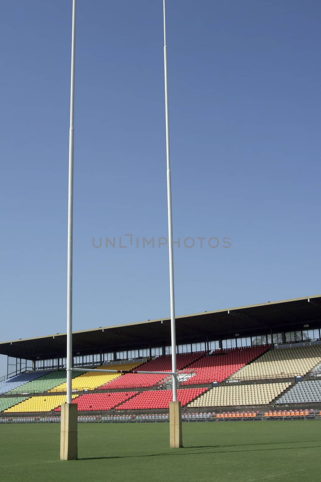 Many Empty Seats In Rows In An Outdoor Sports Stadium