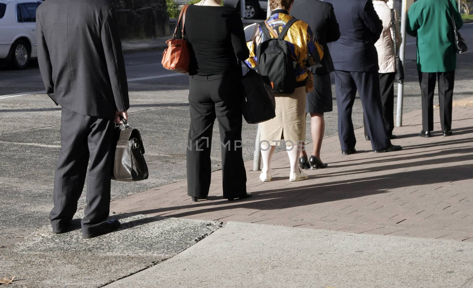 City Workers Waiting For The Bus At The Station In The Morning