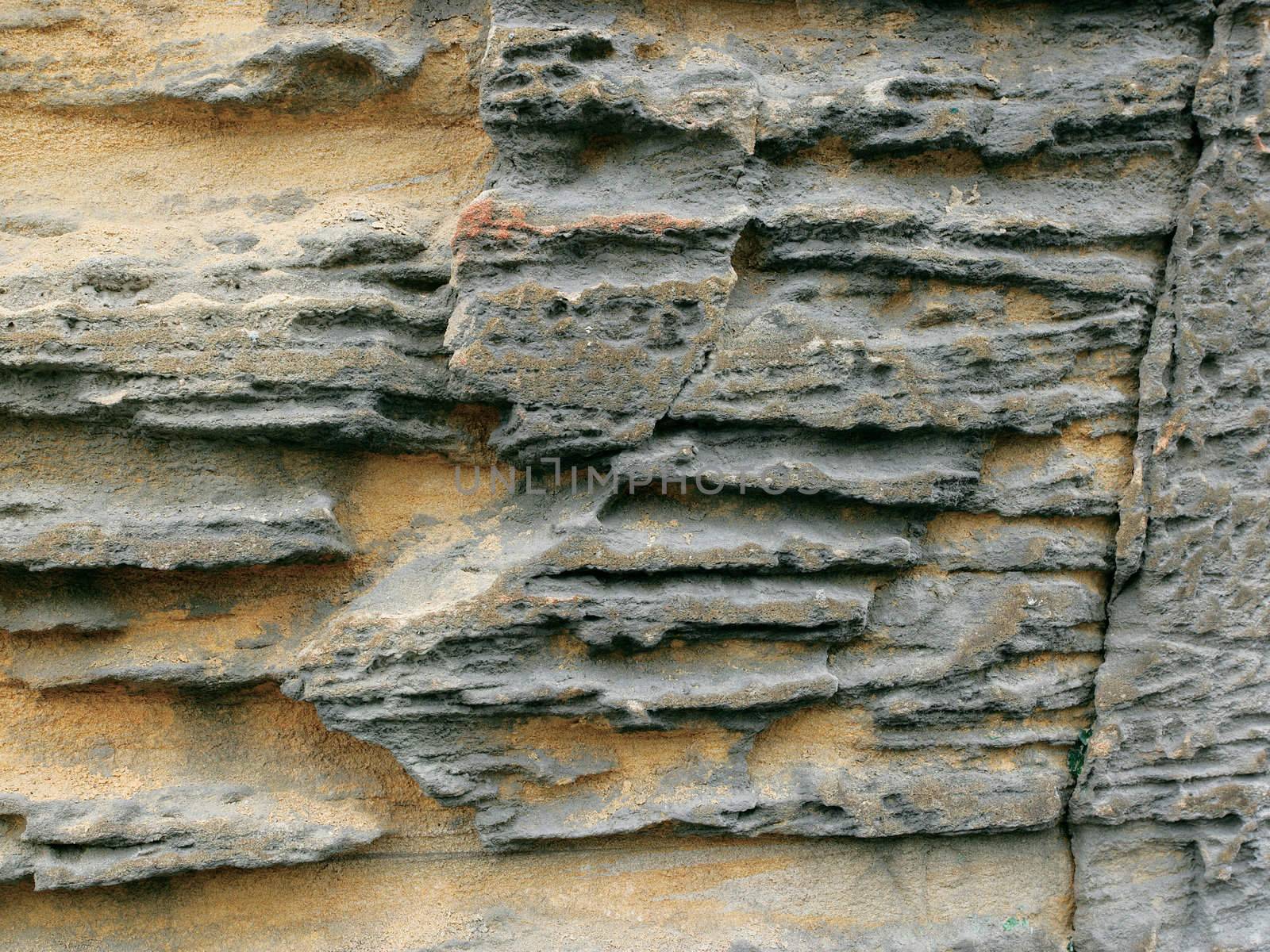 Background image of erosion on a rock wall.
