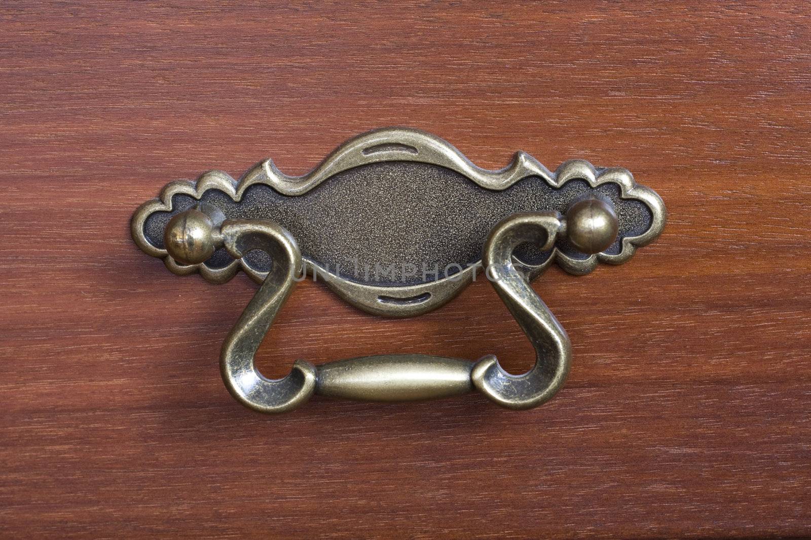 close-up of an antique drawer handle