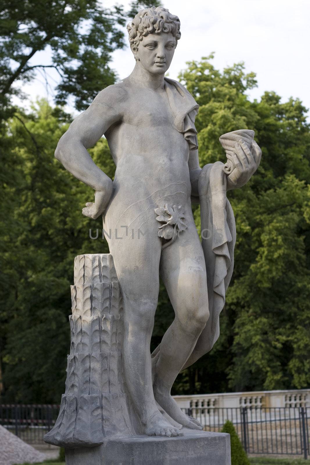 monument of a young naked man with a curly hair