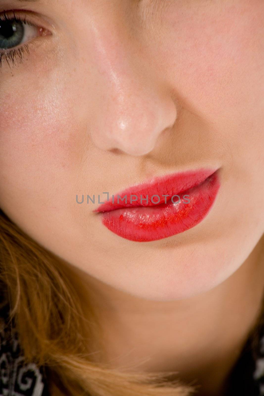 Smile of a beautiful young woman on white background