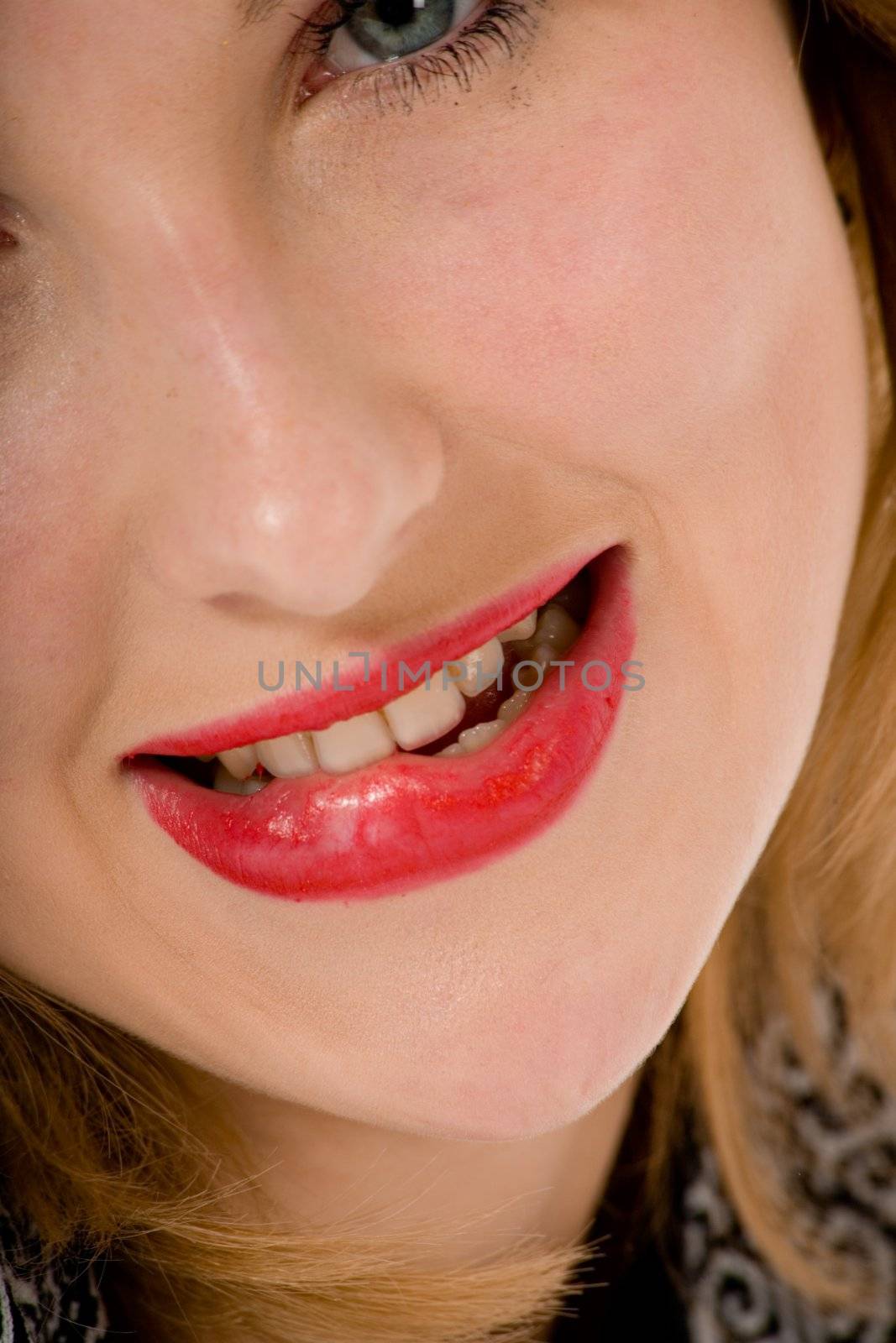 Smile of a beautiful young woman on white background