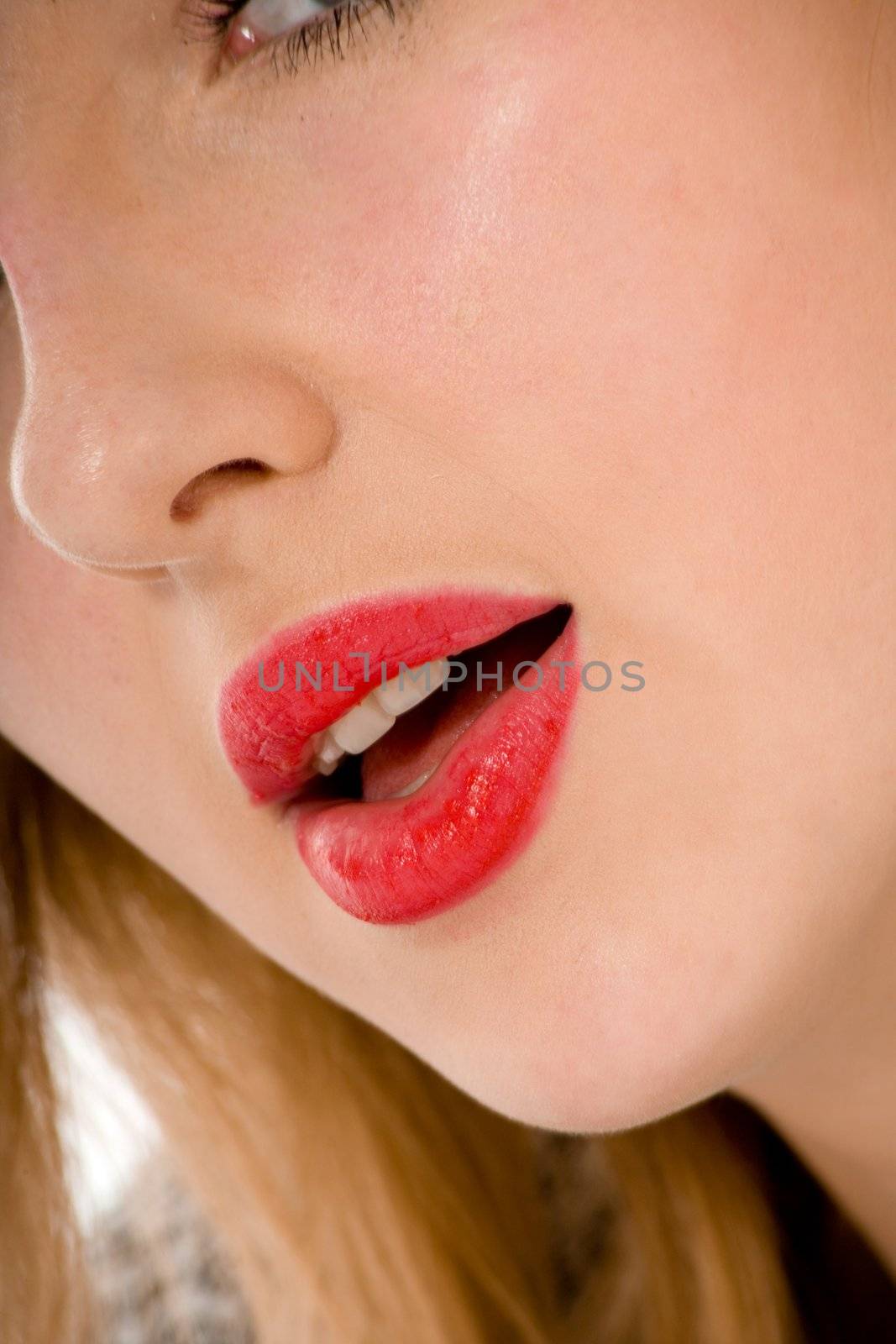 Smile of a beautiful young woman on white background