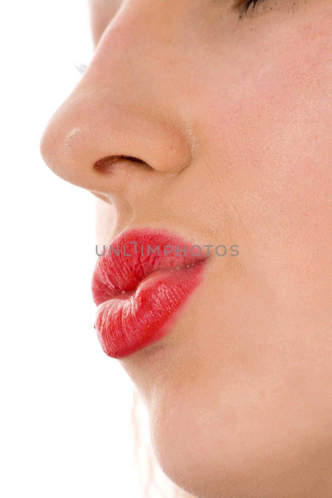 Smile of a beautiful young woman on white background