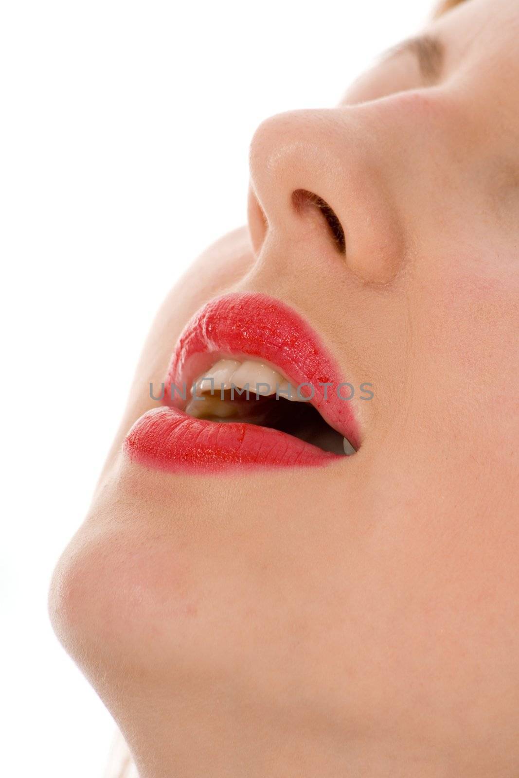 Smile of a beautiful young woman on white background