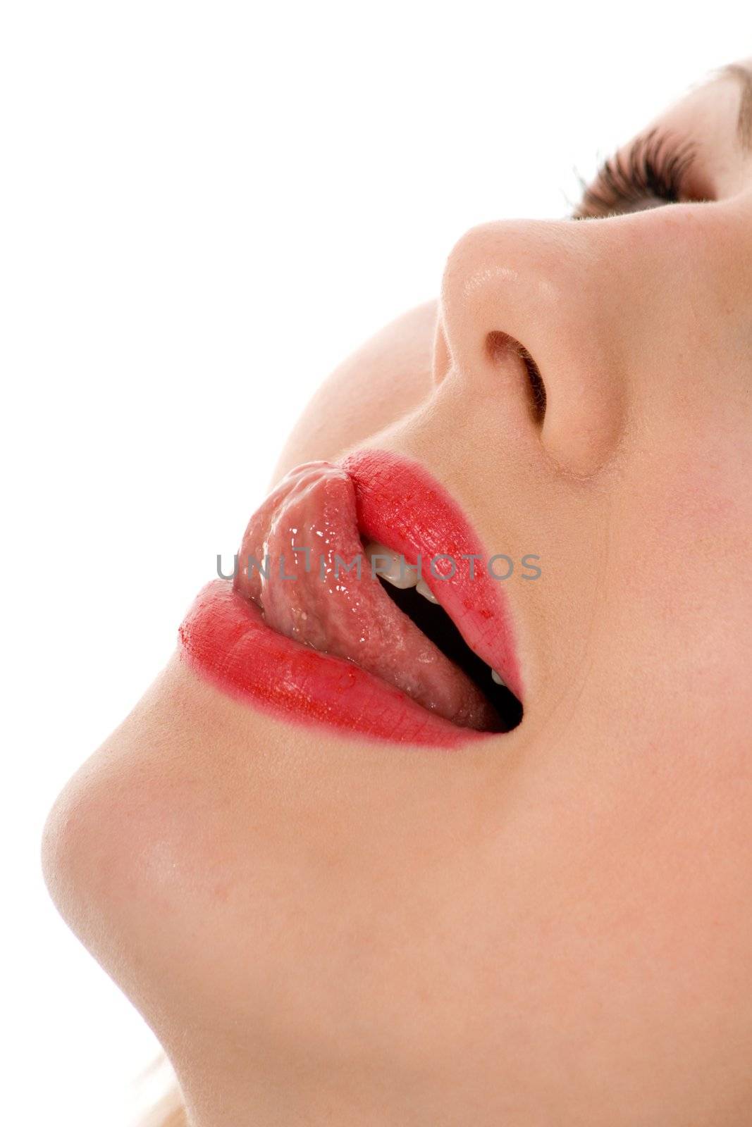 Beautiful woman leaking teeth with tongue close-up
