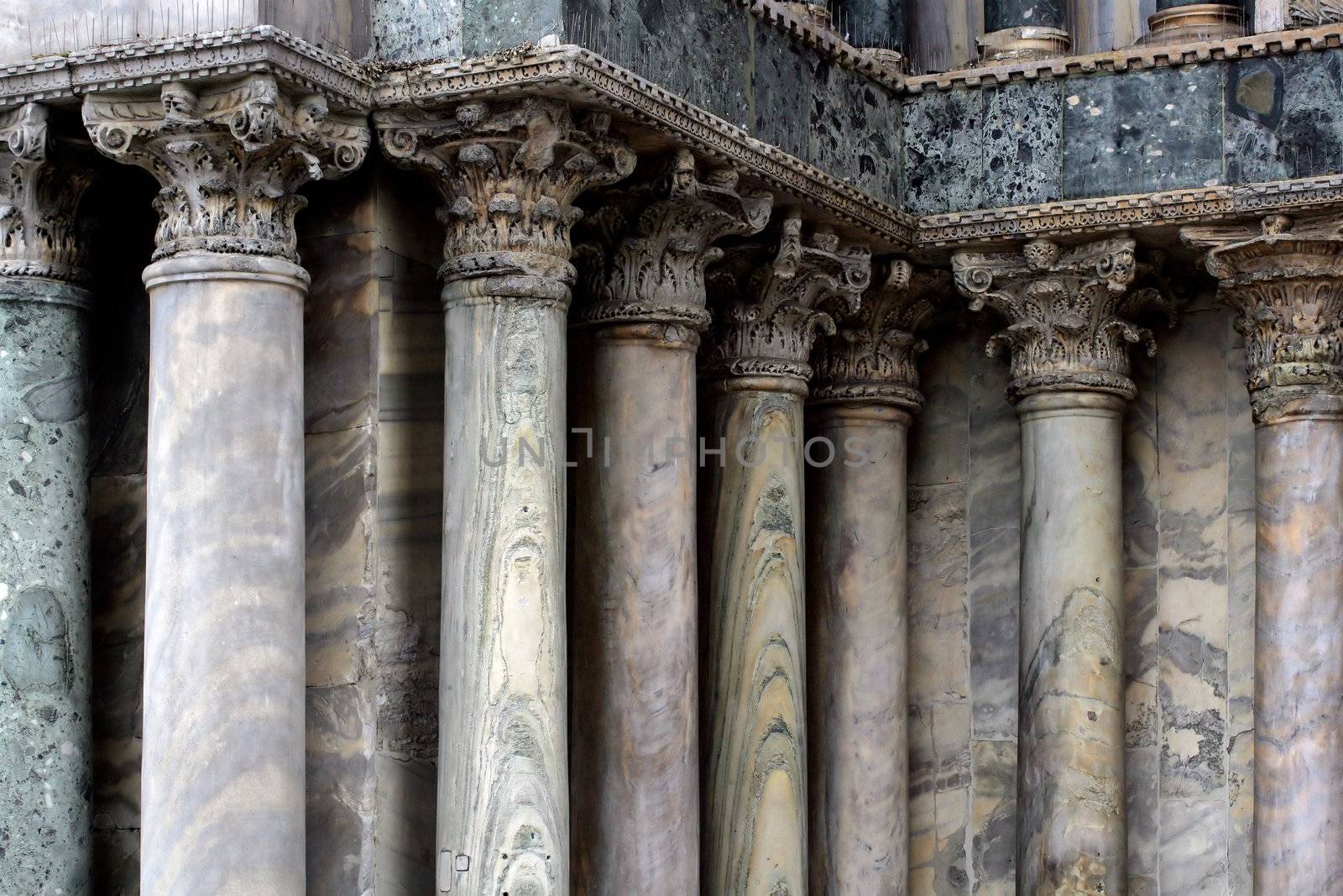 A series of marble columns in Venice Italy.
