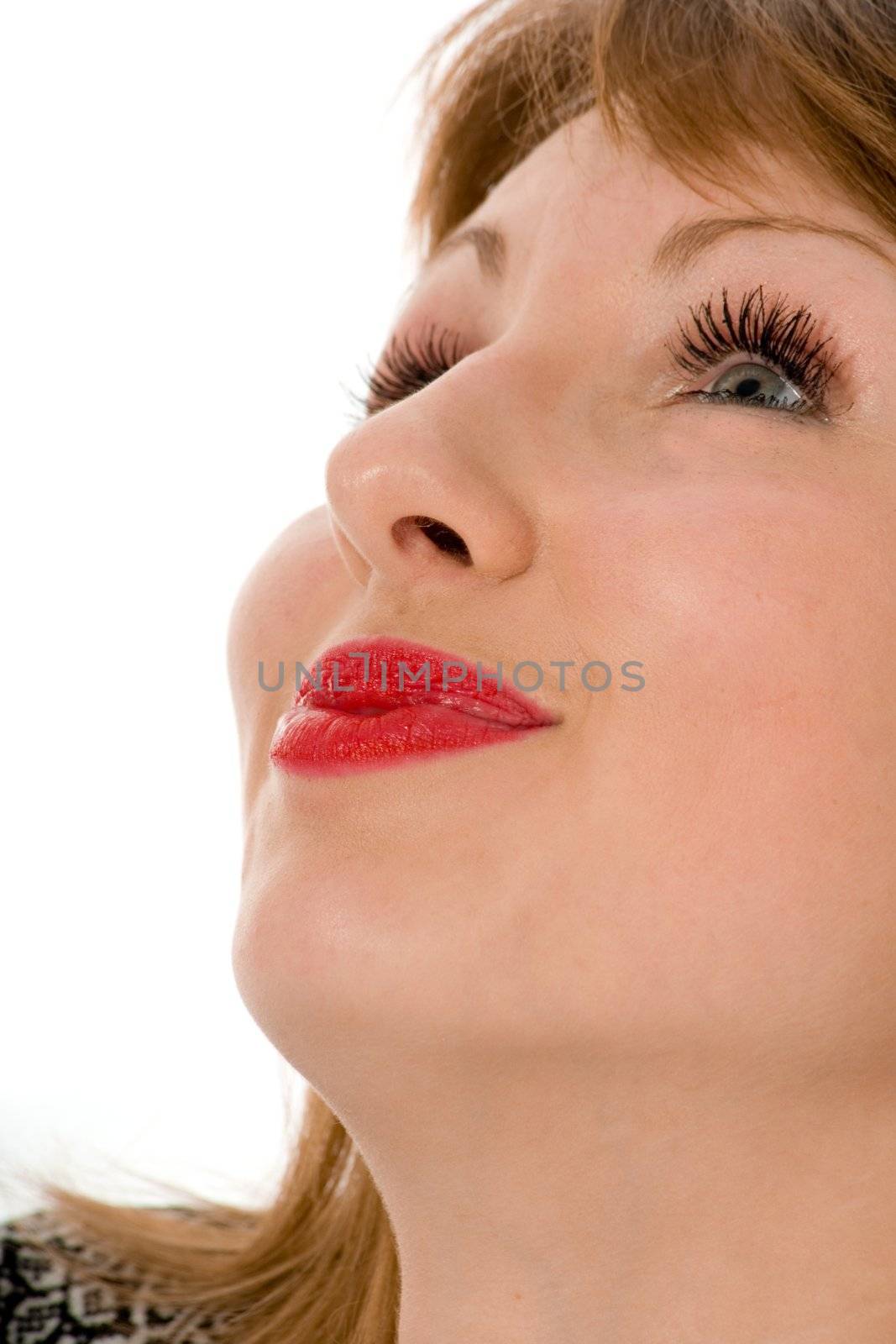 Smile of a beautiful young woman on white background