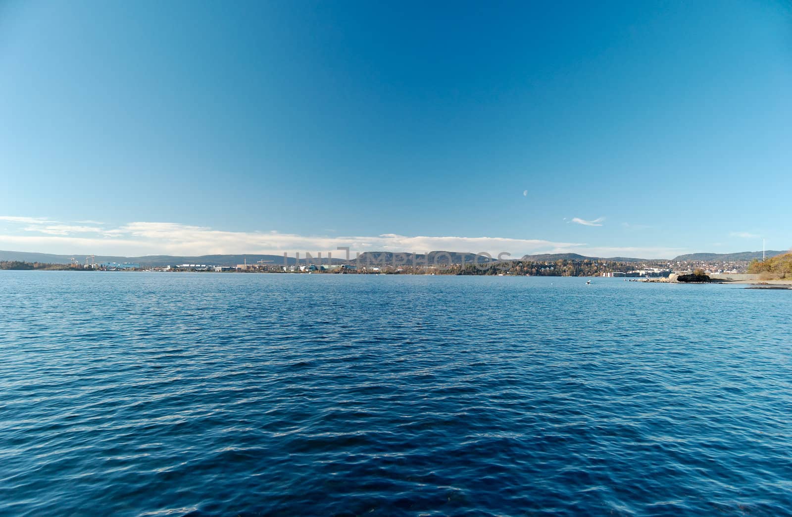 Fish-eye view over Oslo Fjord, looking at Bygøy and Fornebu. Sky and water are filter-polarised.
