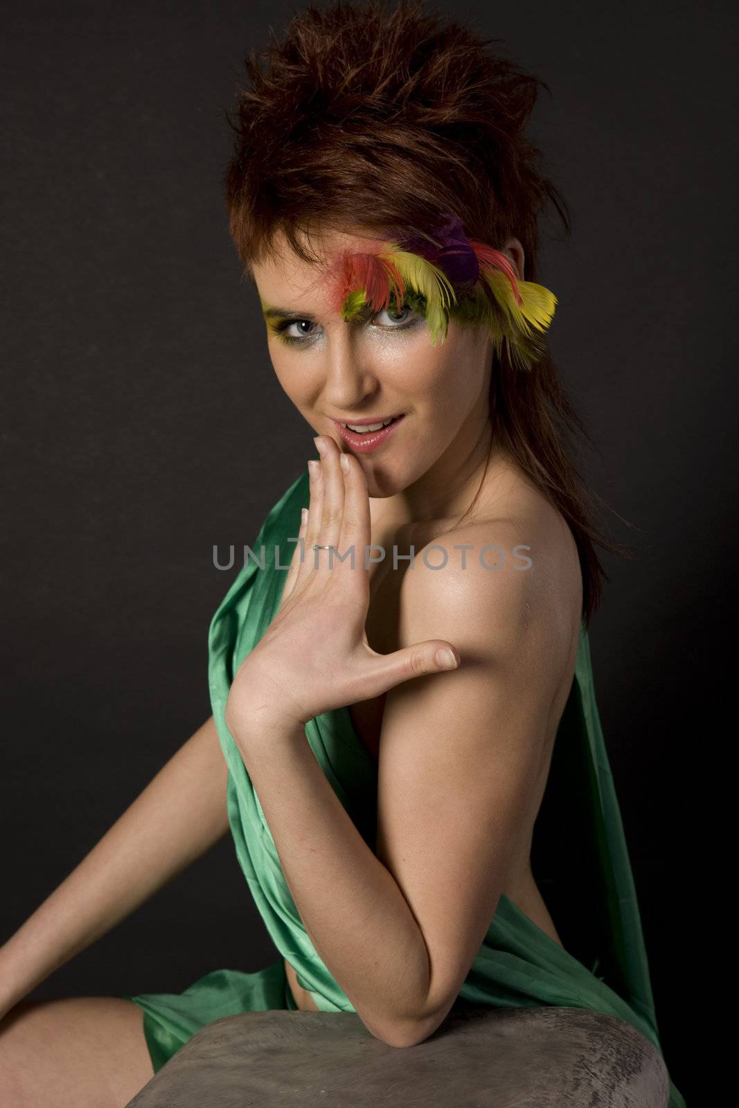 fashion model with feather on face