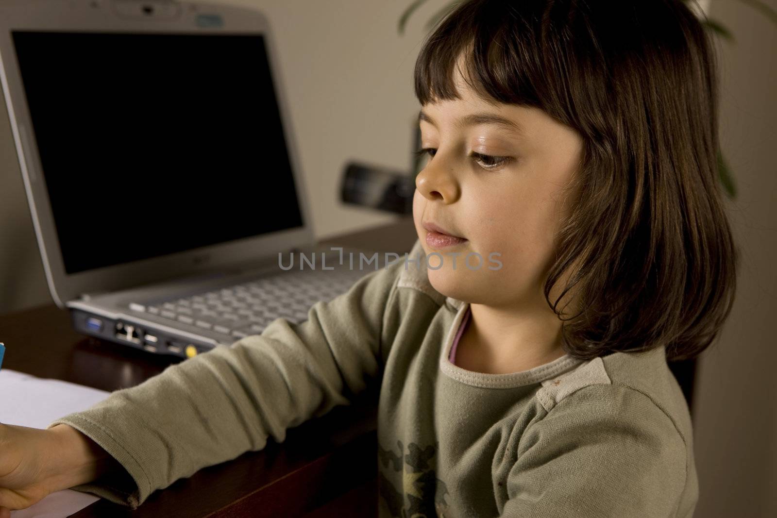 young child working in computer