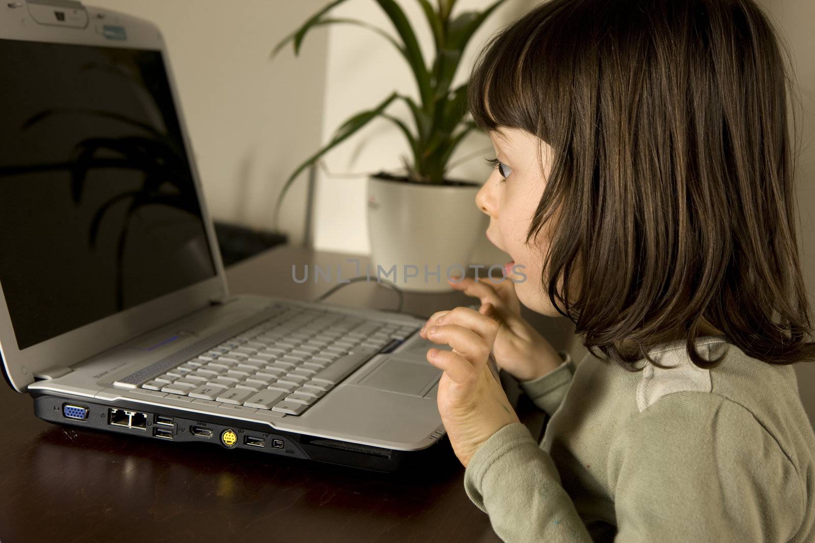 young child working in computer