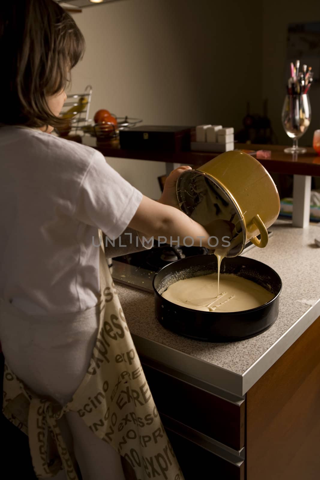  young girl having fun in the kitchen making cookies