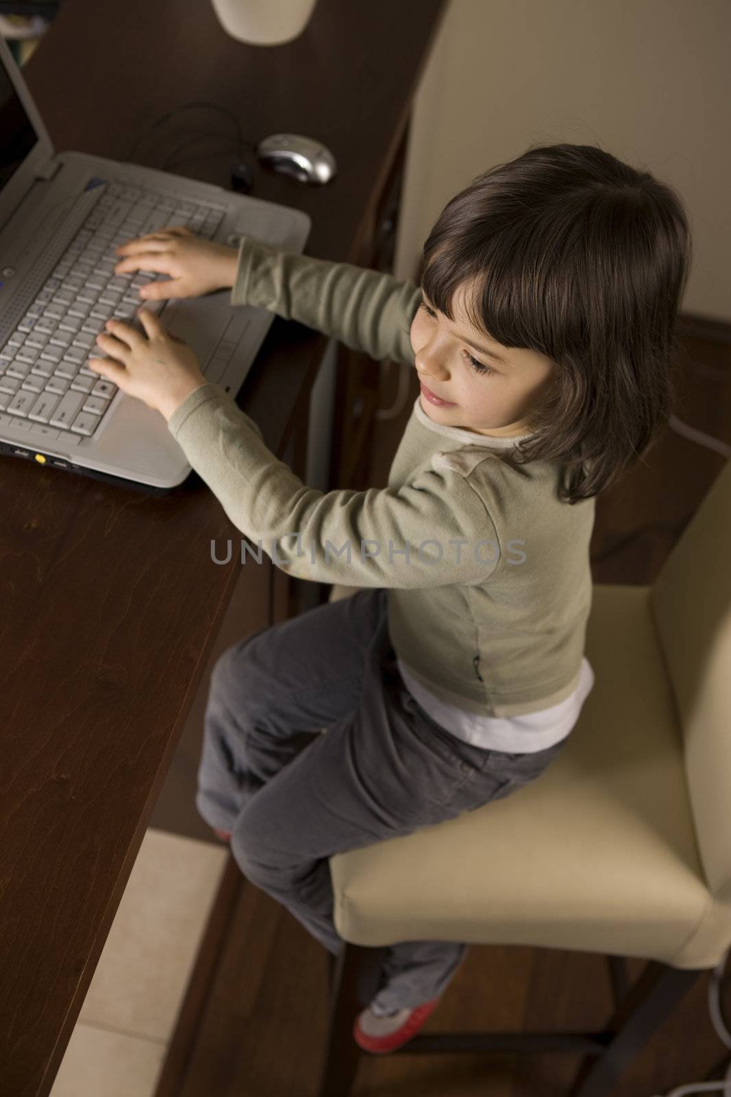 young child working in computer