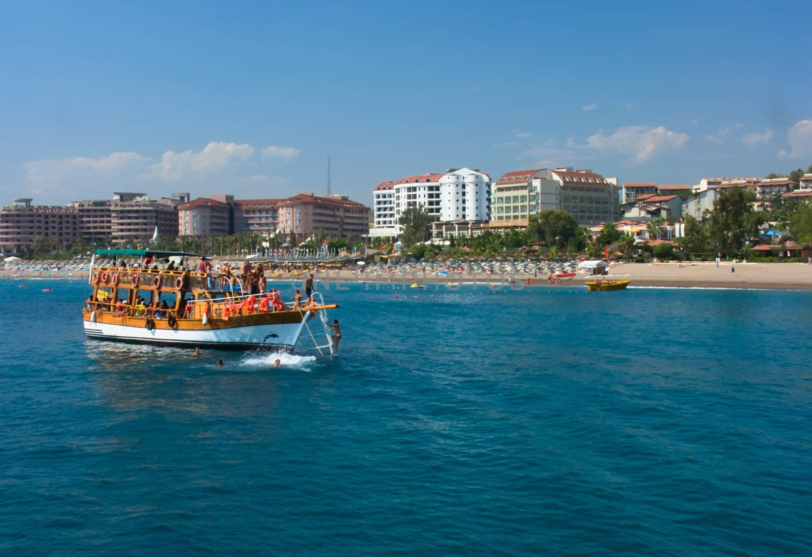 a boat in the sea near the beach