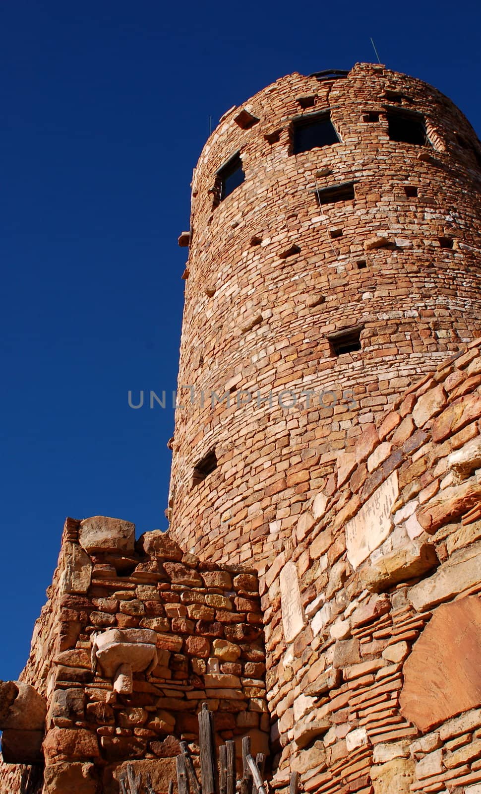 Desert Tower at the Grand Canyon, Arizona, showing a vertical shot up the rustic structure towards the deep blue sky