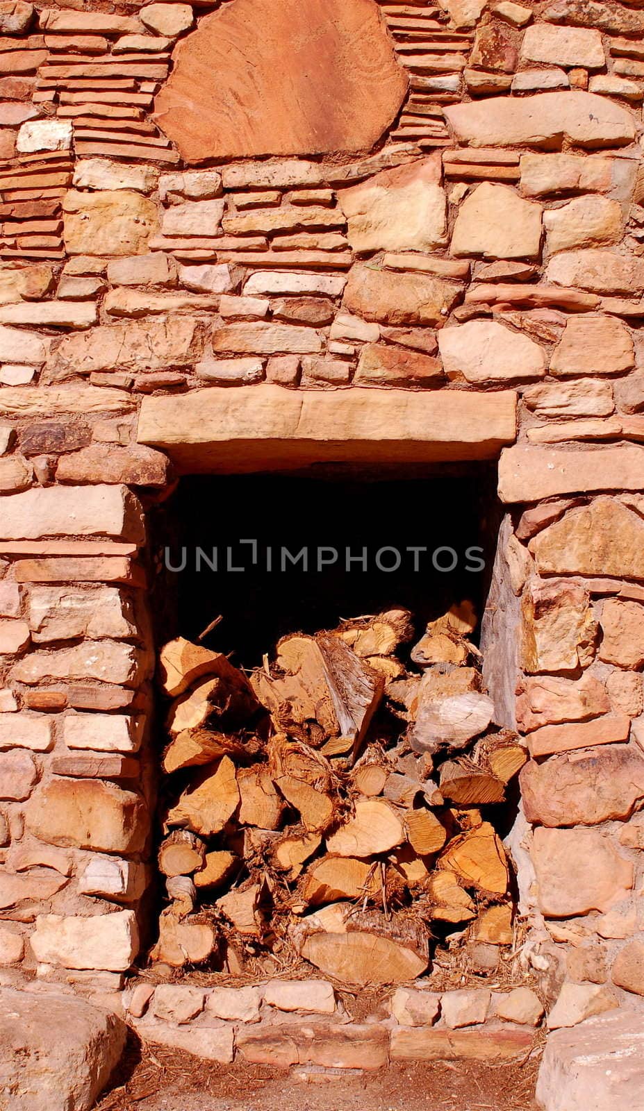 Desert Tower at the Grand Canyon - rustic stone built structure with fire logs stacked in the centre