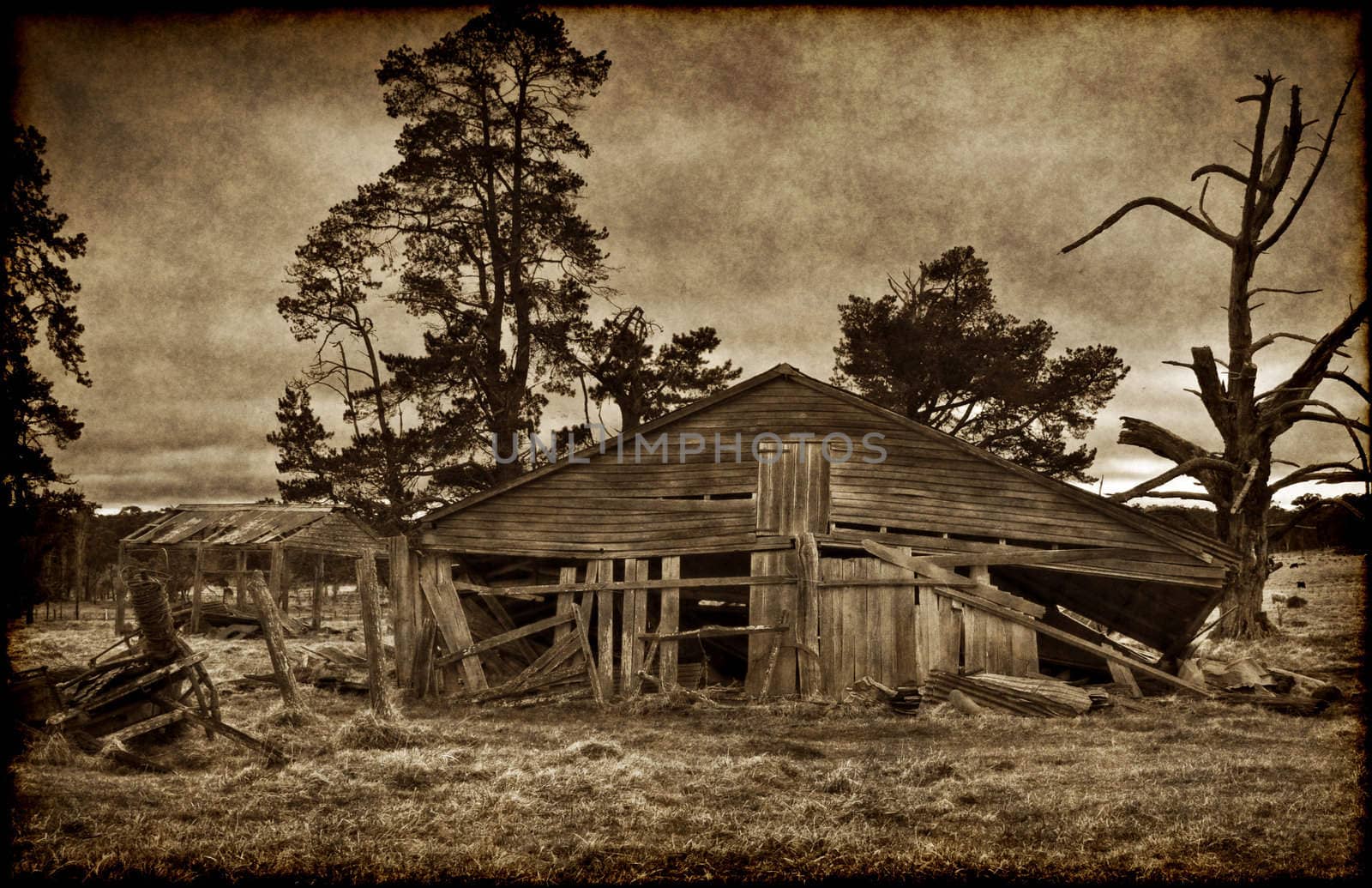 sepia and grungy image of an old farm house
