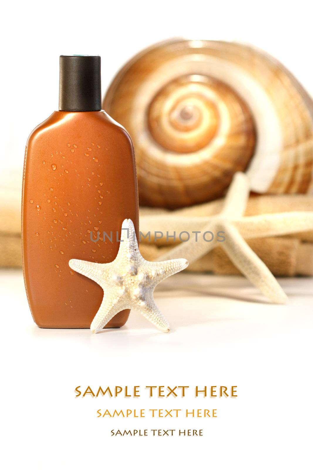 Sun lotion with seashells and towel on white background