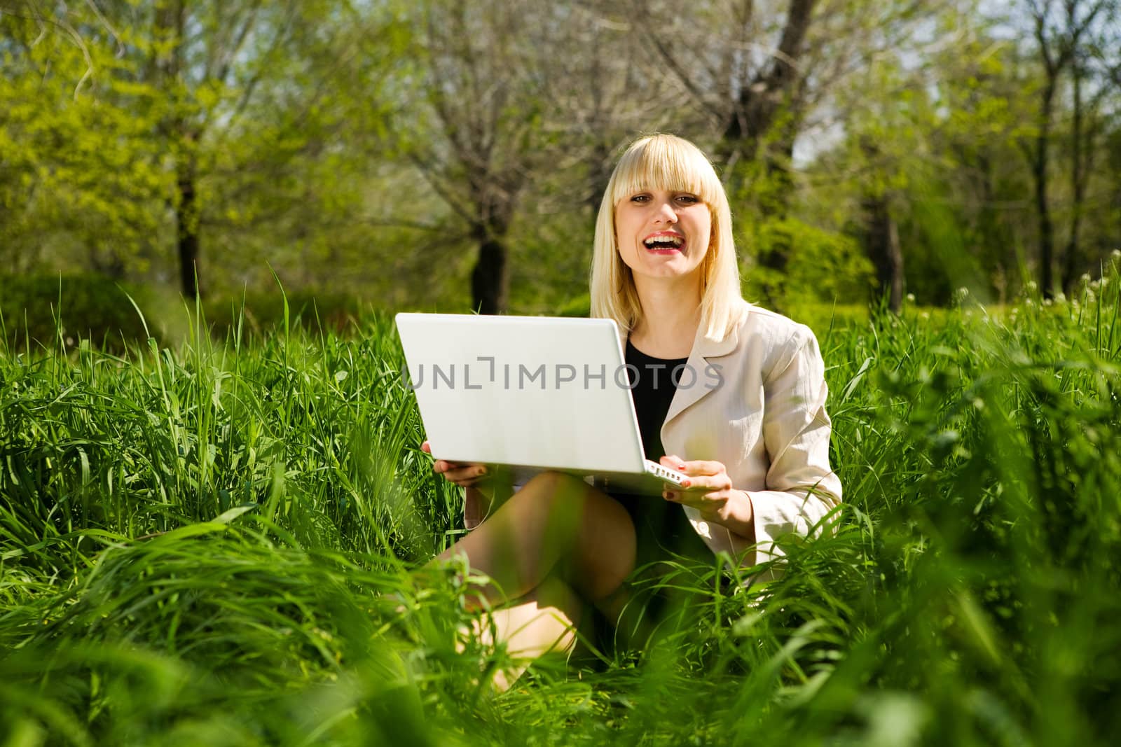 happy young businesswoman with laptop