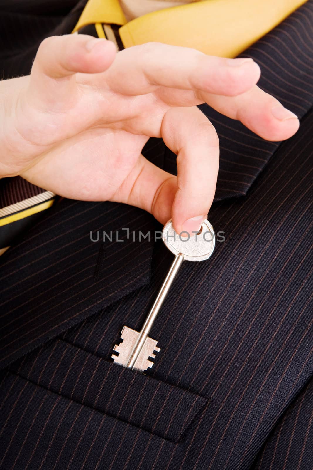 hand of businessman with key