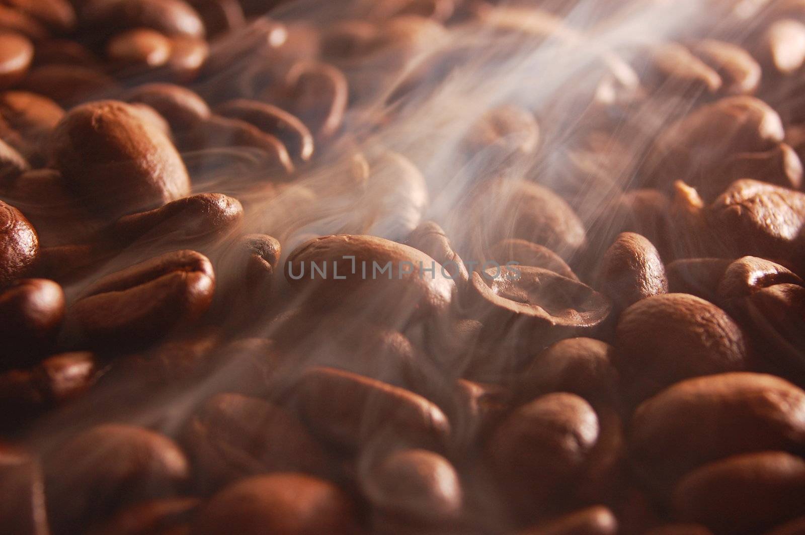 roasting coffee beans with steam and smoke