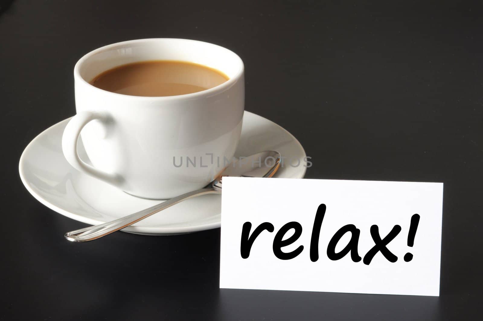 relax or break concept with cup of coffee on black background