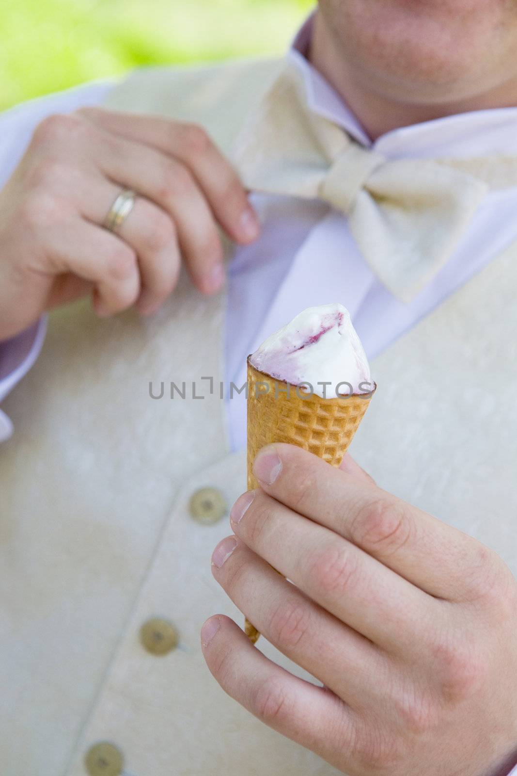 ice-cream in the hand of groom