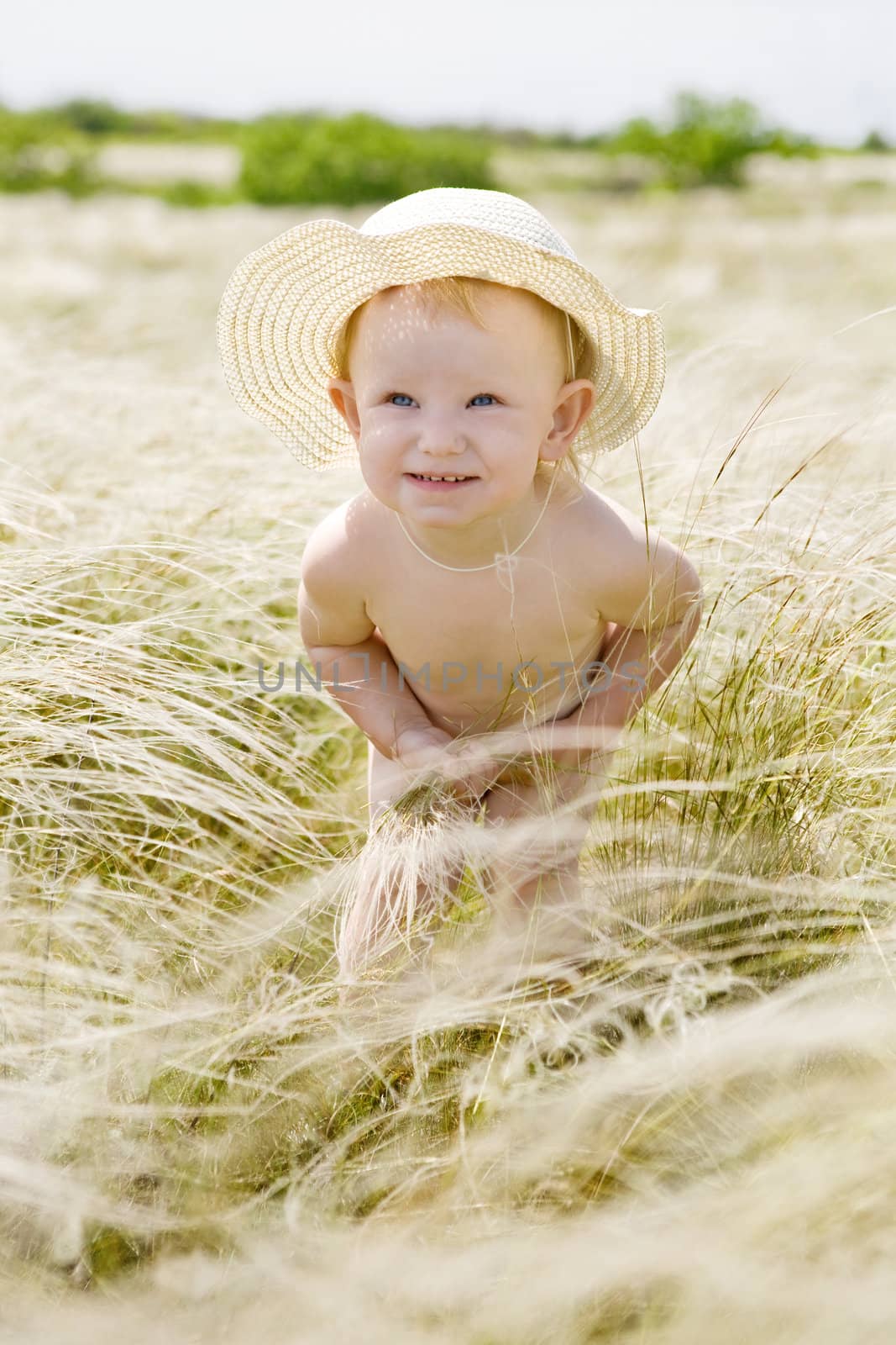 small girl in feather-grass