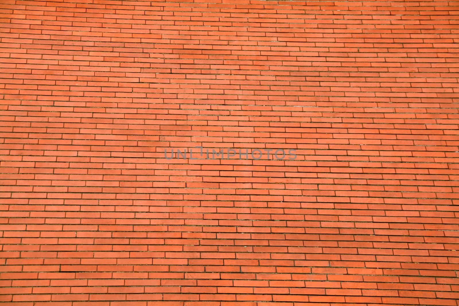 background or pattern of a big red orange brick wall