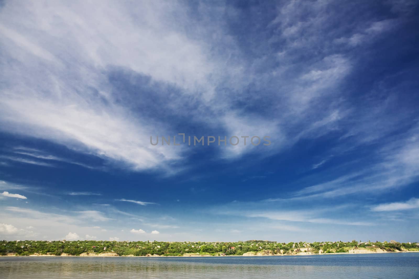 blue sky with clouds over the river by vsurkov