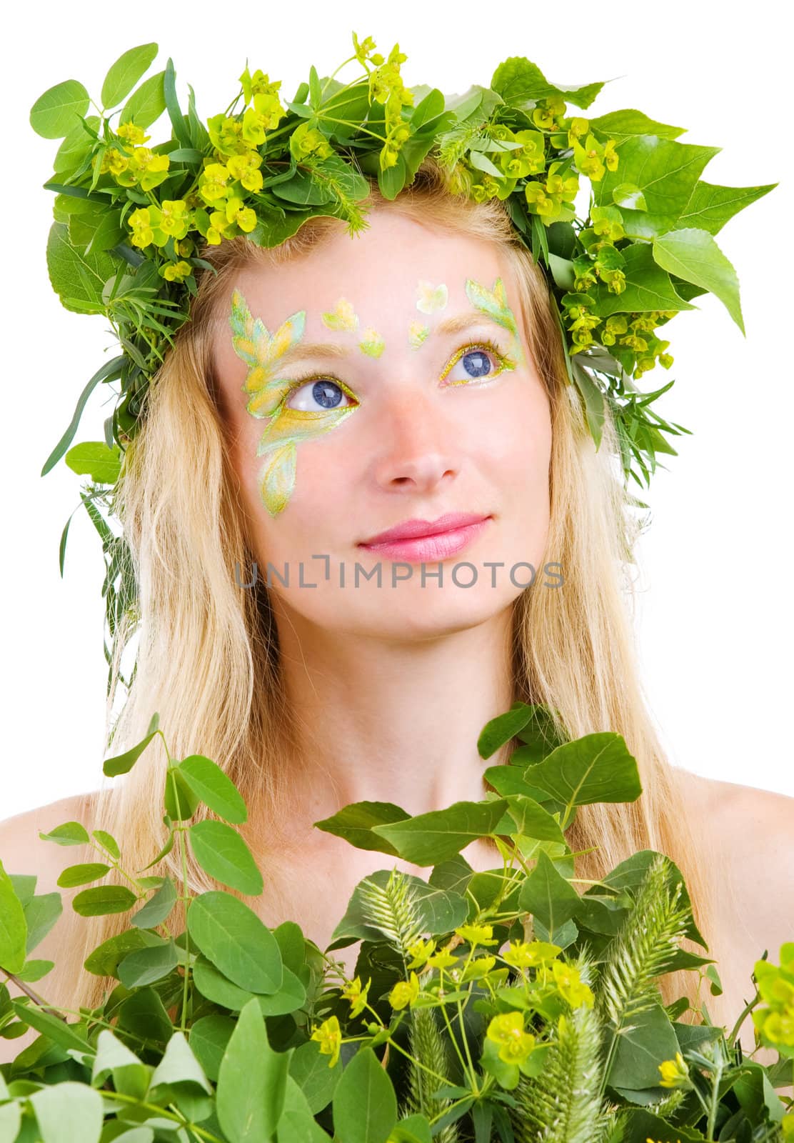 blond girl in green leaves