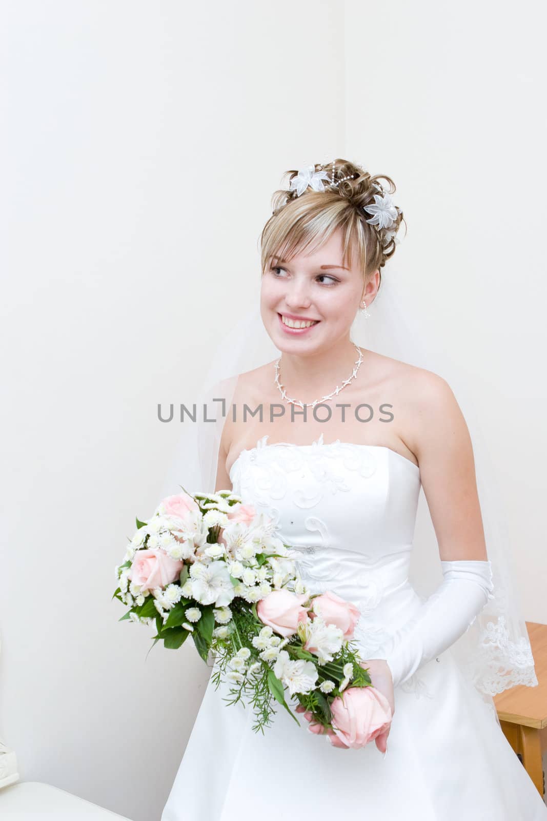 a bride waits for her groom in her house