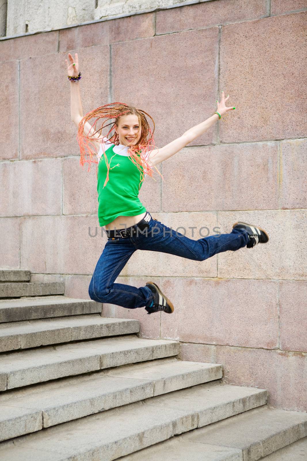 modern girl jumping on the staircase