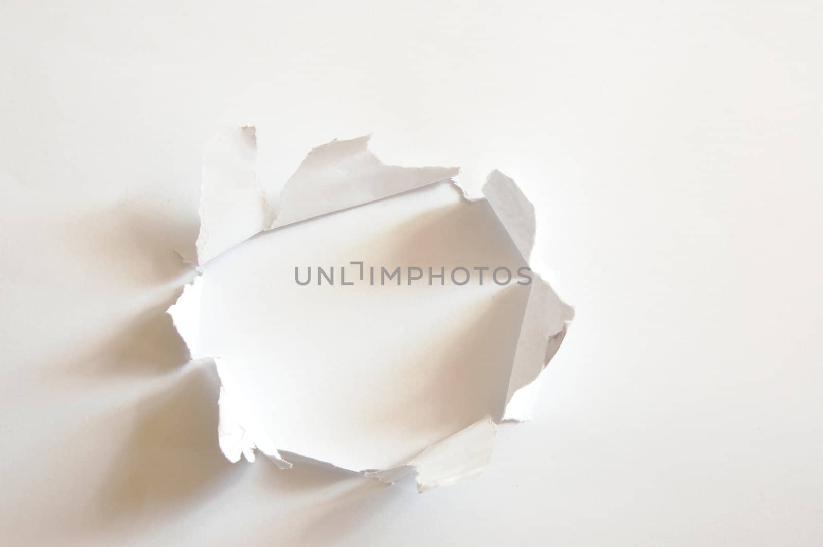 hole with copyspace in blank sheet of paper