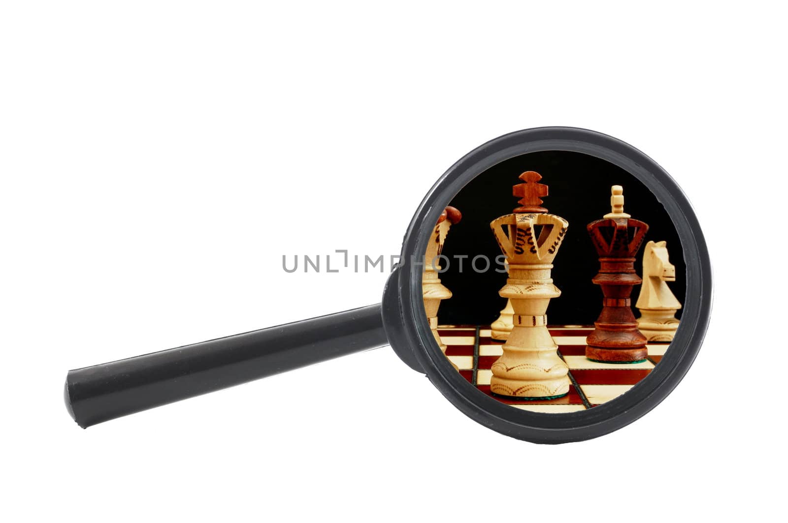 business competition concept with chess pieces and magnifying glass