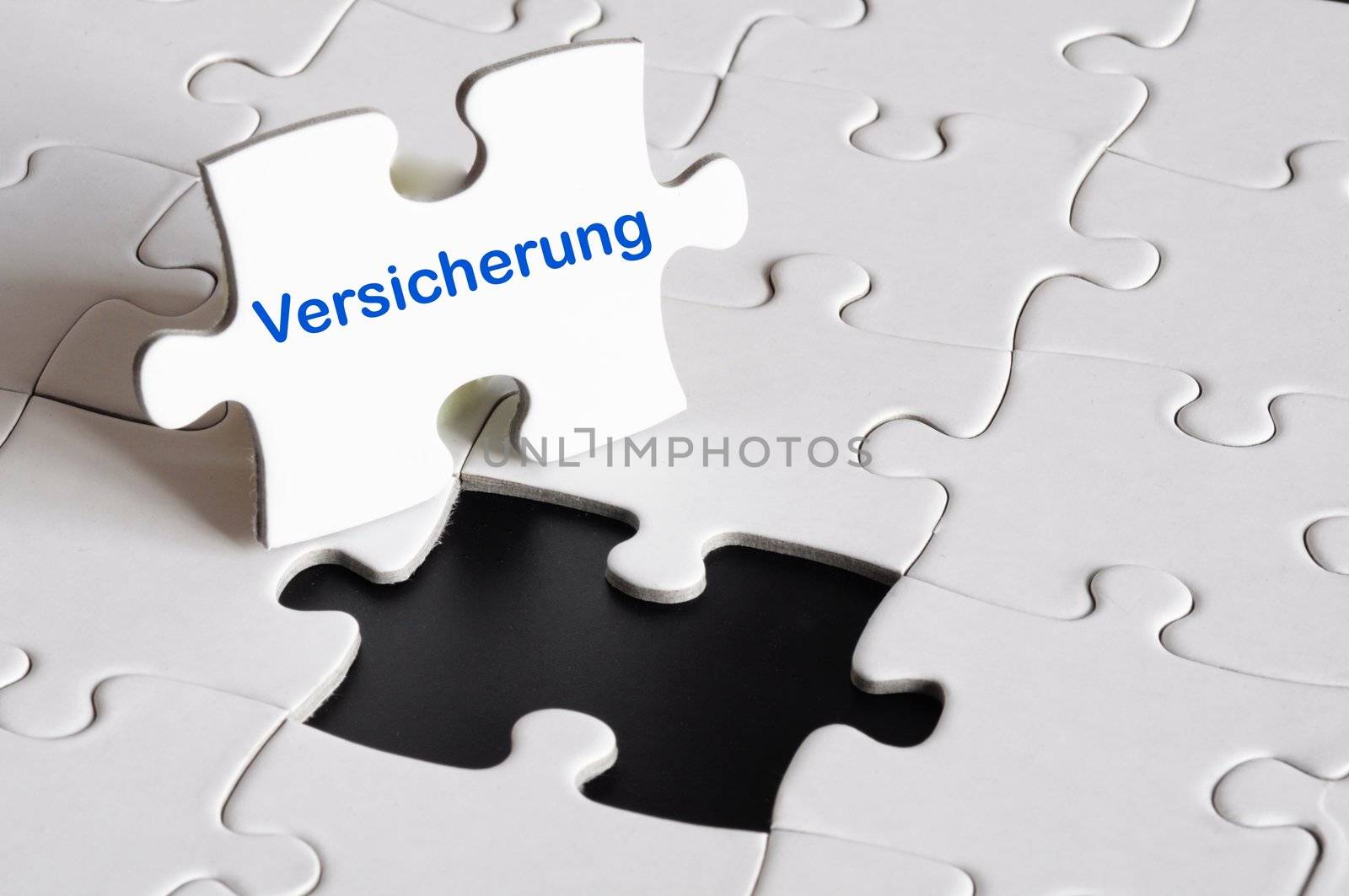 insurance concept with white puzzle or jigsaw
