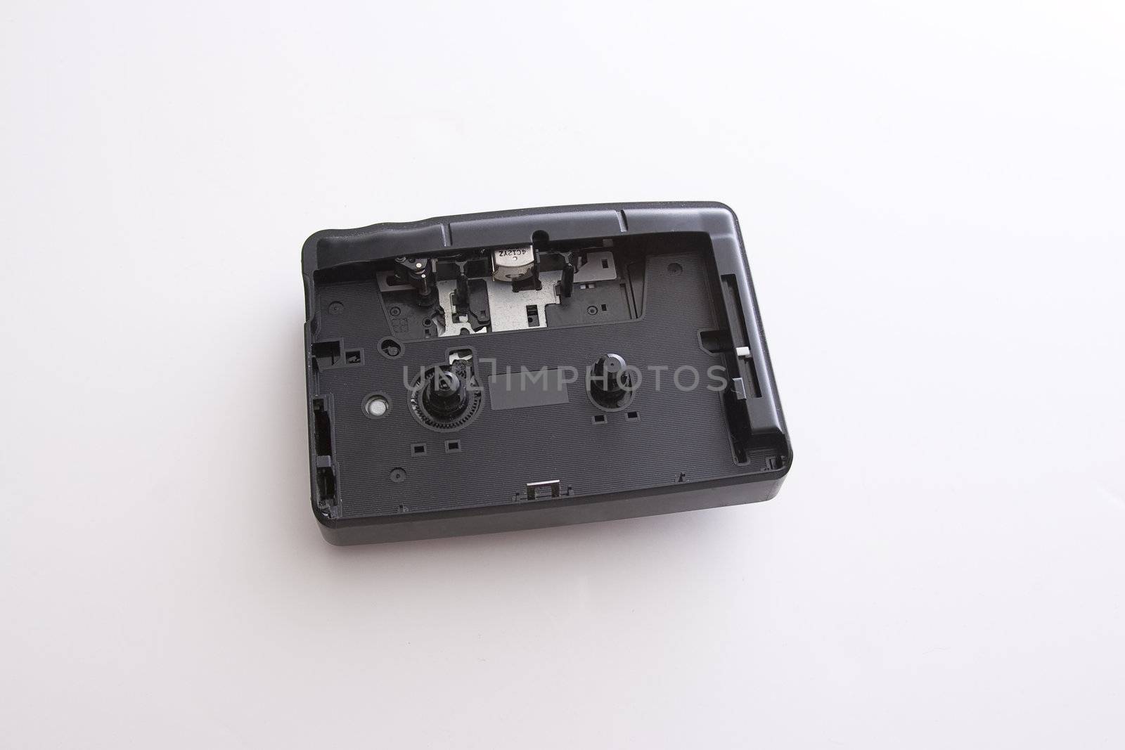 Old dusty casette player with front door ripped out