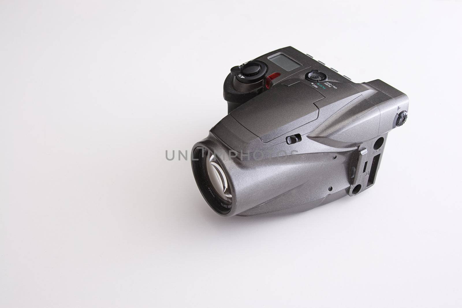 old zoom lens reflex camera against white background